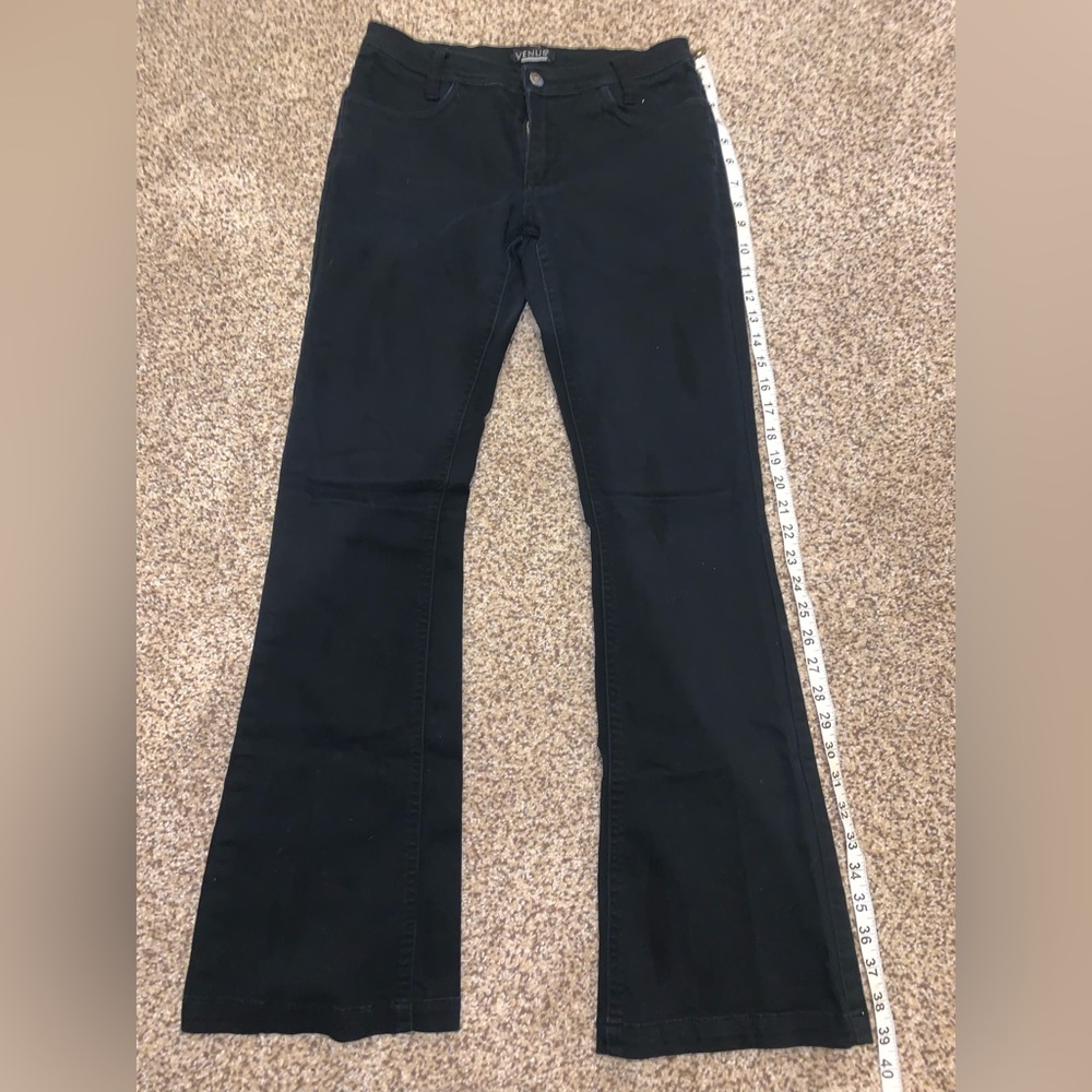 Size 4 black flare, mid rise Venus jeans. Stretchy and comfortable.